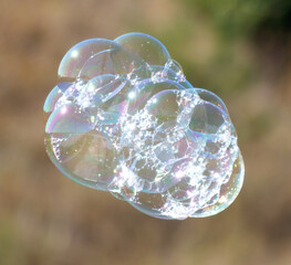 A bubble cloud with a rainbow in the middle
