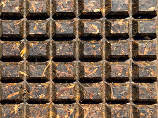 A close up of a brown surface with a lot of squares