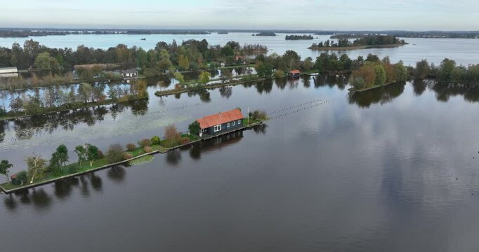 small houses at the Loosdrechtse Plassen, Scheendijk, marina of Breukelen, The Netherlands, nature reserve with tow holes and legakkers