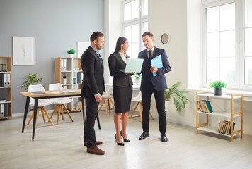 Coworkers engage in discussion and teamwork during an office meeting, emphasizing collaboration, communication, and productivity. Professional people working together towards shared goals.