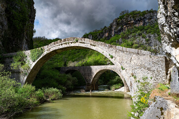 Fototapeta premium View of the traditional stone Bridge of Noutsos or Kokkoros in Epirus, Greece in Spring.