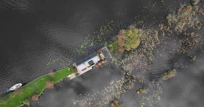 small houses at the Loosdrechtse Plassen, Scheendijk, marina of Breukelen, The Netherlands, nature reserve with tow holes and legakkers