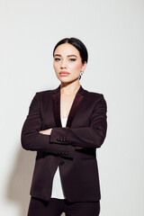 Portrait of a beautiful fashionable woman in a business suit in an office