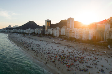 View of Crowded Copacabana Beach and Mountains in the Horizon on Sunset, Rio de Janeiro, Brazil