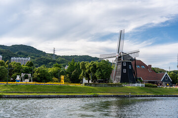 Dutch theme architecture landscape along canal cruising in Huis Ten Bosch Theme Park,Sasebo, Japan