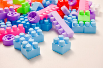 Various colored toy blocks on a white background, educational toys for children