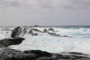 waves crashing on rocks