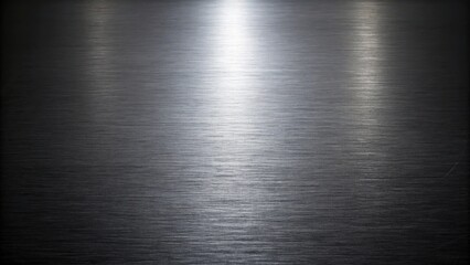 A sleek black polished aluminum background with a subtle gradient effect creating depth and visual interest, dark tone, metallic finish