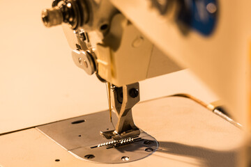 detail of the needle on a modern, sturdy industrial sewing machine