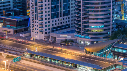 Dubai Marina skyscrapers aerial top view before sunrise from JLT in Dubai night to day timelapse,...