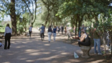 People walking in blurred villa borghese gardens with sunlight filtering through trees, featuring men and women in an outdoor setting in rome.