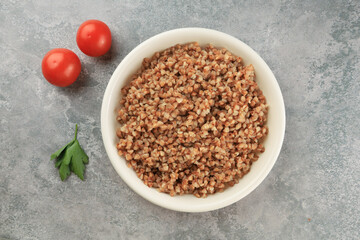 Buckwheat on a white plate  - food photography. Top view. Russian food..