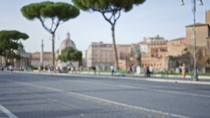 Blurred image captures people walking among the historic ruins and lush trees of the roman forum in rome, italy, showcasing the vibrant blend of ancient and modern life.