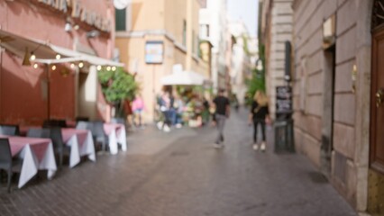Blurred street scene in rome with defocused view of people walking through historic outdoor area...
