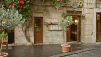 Blurred street scene in rome with defocused view of an old italian restaurant's exterior, surrounded by greenery and stone architecture, capturing the city's historic charm.