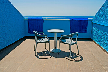 Hotel balcony by the ocean all in blue