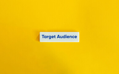Target Audience. Text on Block Letter Tile on Yellow Background. Minimal Aesthetic.