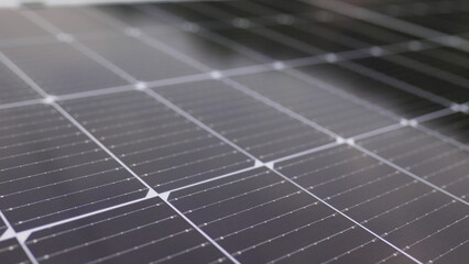 Photovoltaic solar panel extreme close up. Close-up of modern photovoltaic solar battery panels. Rows of sustainable energy solar panels installed on terrace. Solar panels on roof top. Panels at home