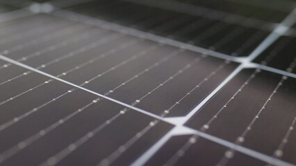 Close-up of modern photovoltaic solar battery panels. Solar panel, photovoltaic, alternative electricity source. Efficient ecological solar farm. Photovoltaic solar panel extreme close up