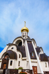 Ornate Orthodox church dome with golden cupola and arched details