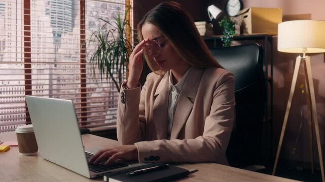 Tired Caucasian business woman female girl businesswoman office worker employer work online laptop typing computer take off glasses rubbing nose eyes bad vision eyestrain headache fatigue pain indoor