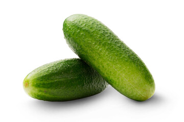 Fresh green cucumbers on white
