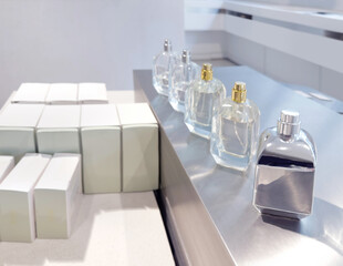 buying perfume, toilet water at cosmetics section in store. choosing cosmetics, perfumes, creams