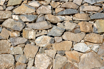 Old rough natural stone wall texture