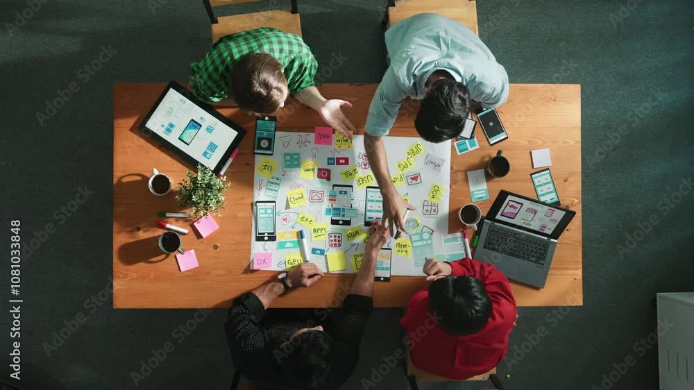 Poster top view of skilled business team discuss idea about ux ui design for mobile phone interface. smart 