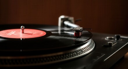 Classic turntable playing vinyl record with red label