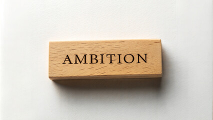 Obraz premium Wooden block with the word 'Ambition' representing motivation and goals.