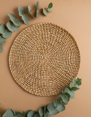 Natural woven mat with green leaves