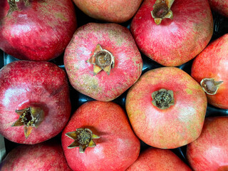 Group of pomegranates. Pomegranate closeup. Red pomegranate Background or wallpaper.
