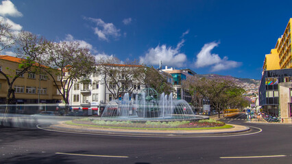 Obraz premium Streets of Funchal town on Madeira and fountain with globe timelapse hyperlapse