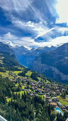 aerial view of mountain town in the swiss alps from a gondola
