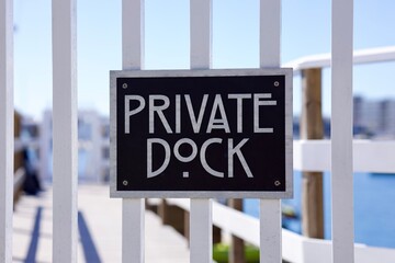art deco sign on a private dock on the marina