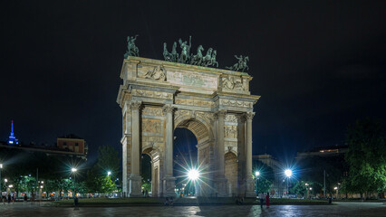 Obraz premium Arch of Peace in Simplon Square timelapse hyperlapse at night. It is a neoclassical triumph arch