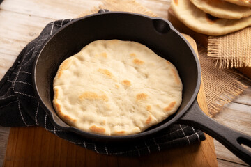 Bazlama. Turkish flatbread whose main ingredients are wheat flour, yeast, water and salt, delicious and versatile homemade recipe very popular in the Middle East.