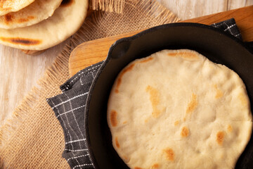 Bazlama. Turkish flatbread whose main ingredients are wheat flour, yeast, water and salt, delicious and versatile homemade recipe very popular in the Middle East.
