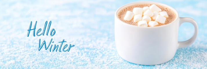 A warm cup of hot chocolate topped with marshmallows, set against a snowy blue background with "Hello Winter" text, evoking a cozy winter vibe.