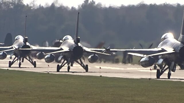 silhouettes fighter jets taxiing airbase demonstrate their for combat operations reflects military's commitment to maintaining operational effectiveness during air force ready war 