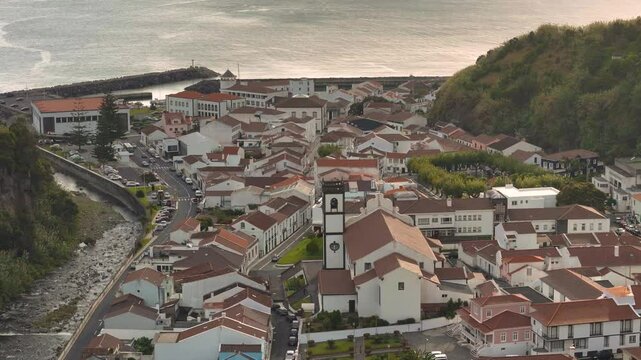 Povoacao, Sao Miguel Island, Azores. Aerial 4K drone video footage of Azorean town with a town hall, church, and stunning ocean and mountain views.