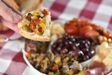 portion of olives with cheese cherry tomatoes and parma ham snack healthy food vegan salad