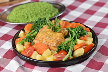 codfish typical Portuguese dish baked cod with onion garlic peppers and potatoes rustic Portuguese food salted fish cooked olive oil