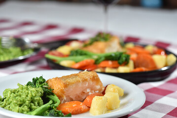 codfish typical Portuguese dish baked cod with onion garlic peppers and potatoes rustic Portuguese food salted fish cooked olive oil