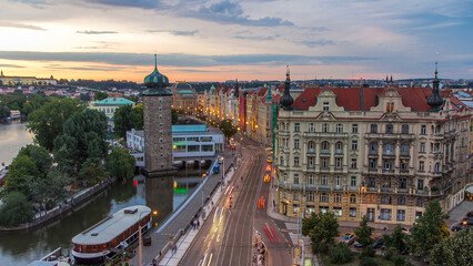 Sitkovska water-tower timelapse and traffic on road in old city center of Prague day to night.