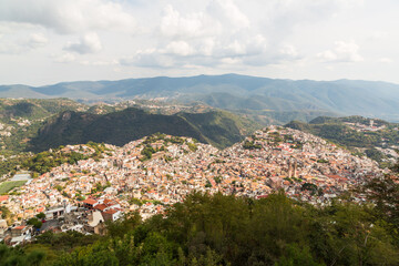 Aerial panoramic view over Pueblo Magico of Taxco, one of Mexico's most scenic towns with Santa...