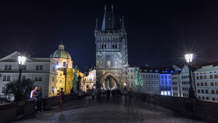 Fototapeta premium Magnificent Gothic structure called Stare Mesto Tower timelapse hyperlapse on Charles Bridge
