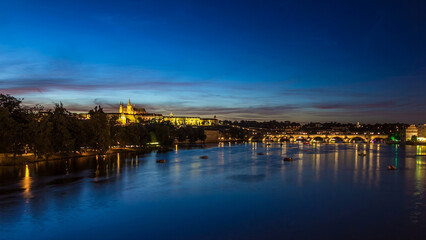 Fototapeta premium View of the city Prague in Czech Republic day to night timelapse on the Vltava river with beautiful sky