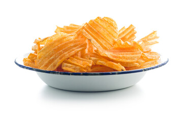 Crispy potato chips on plate  isolated on white background.